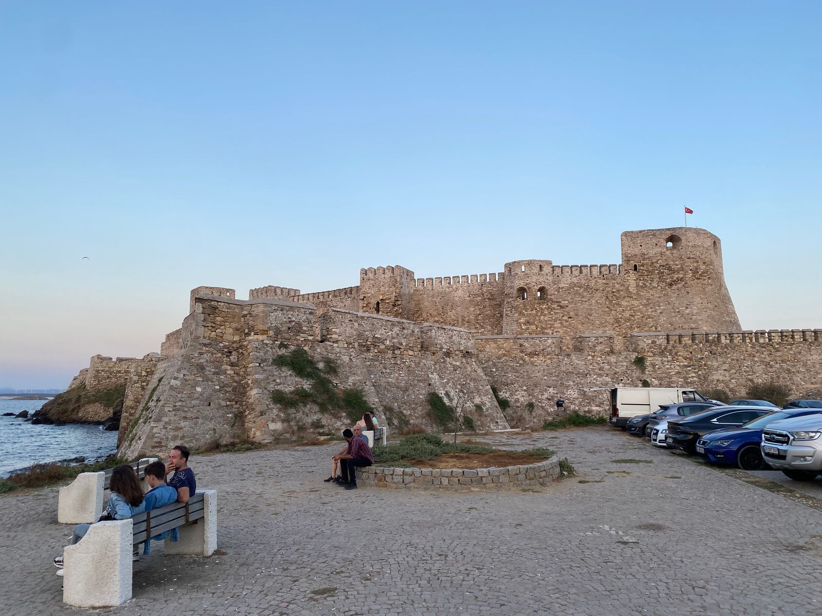 The walls of Bozcaada Castle at the mouth of the harbour.